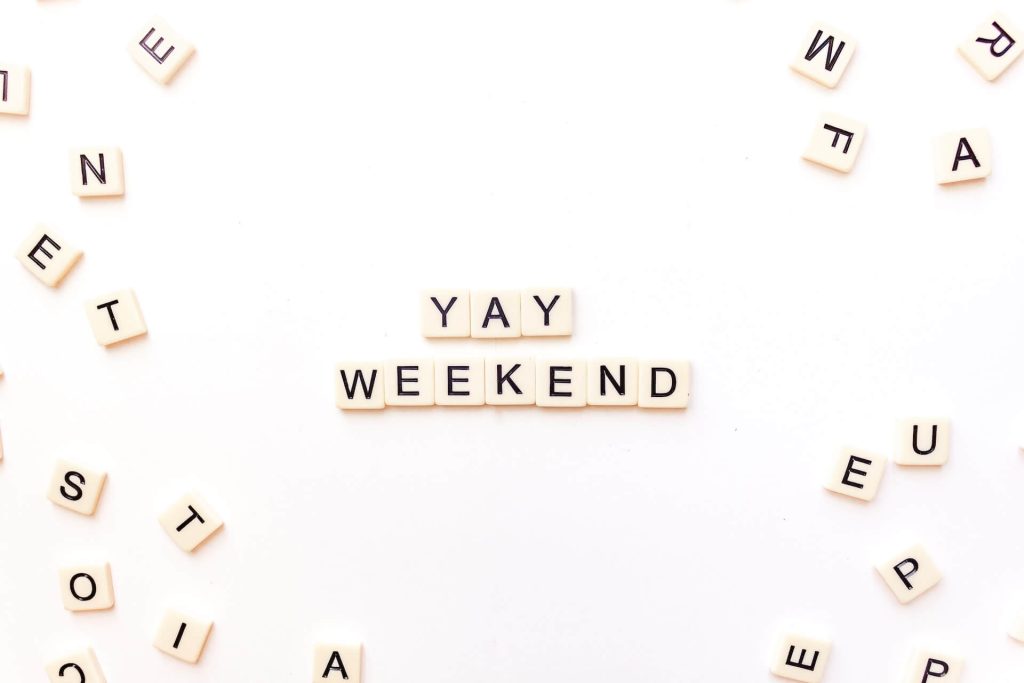 scrabble tiles spelling out "yay weekend"