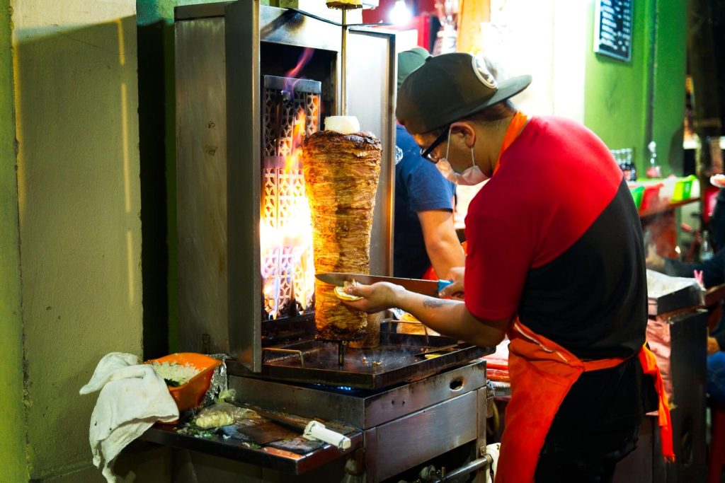 making Al Pastor tacos at tacos el betin in Mexico City