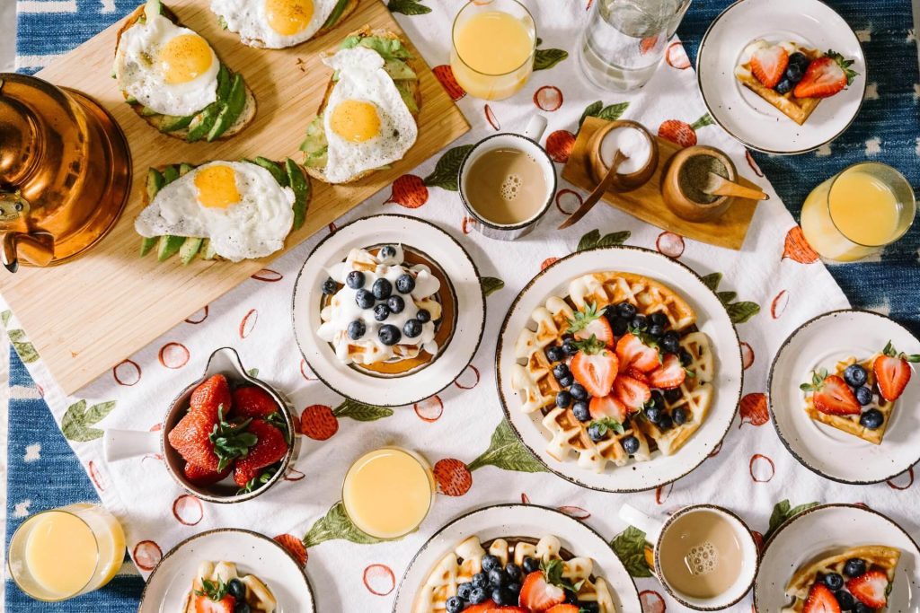 large table filled with breakfast food