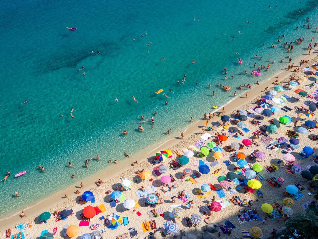 beach in italy with lots of umbrellas