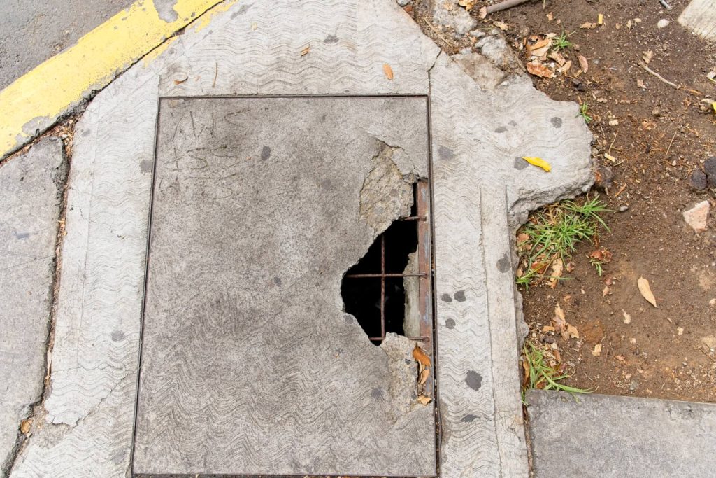 hole in sidewalk