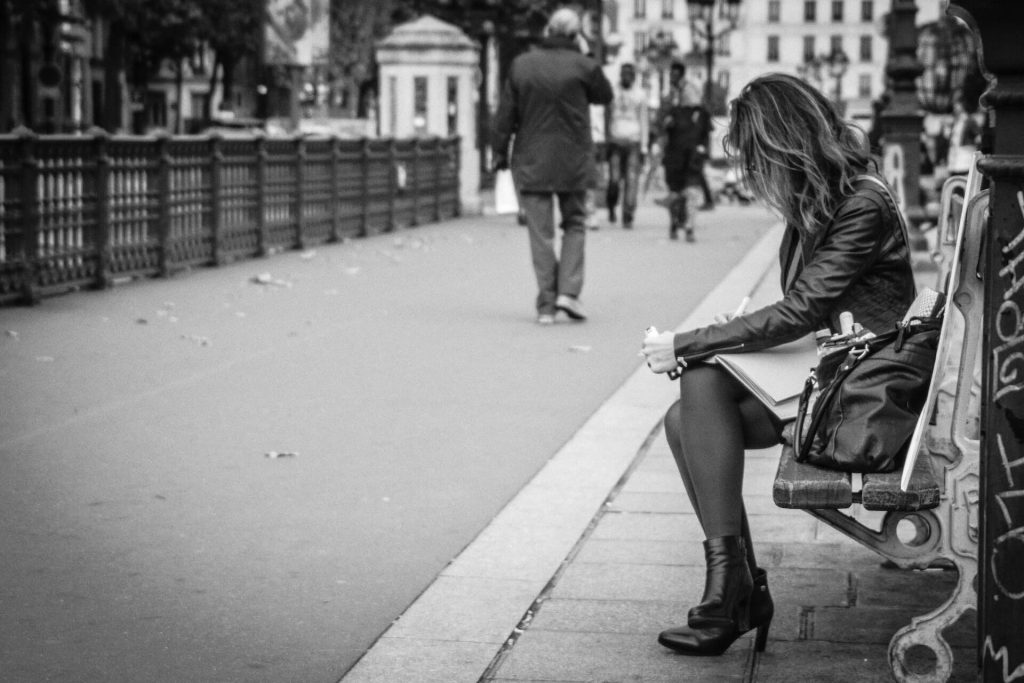 woman sitting on park bench