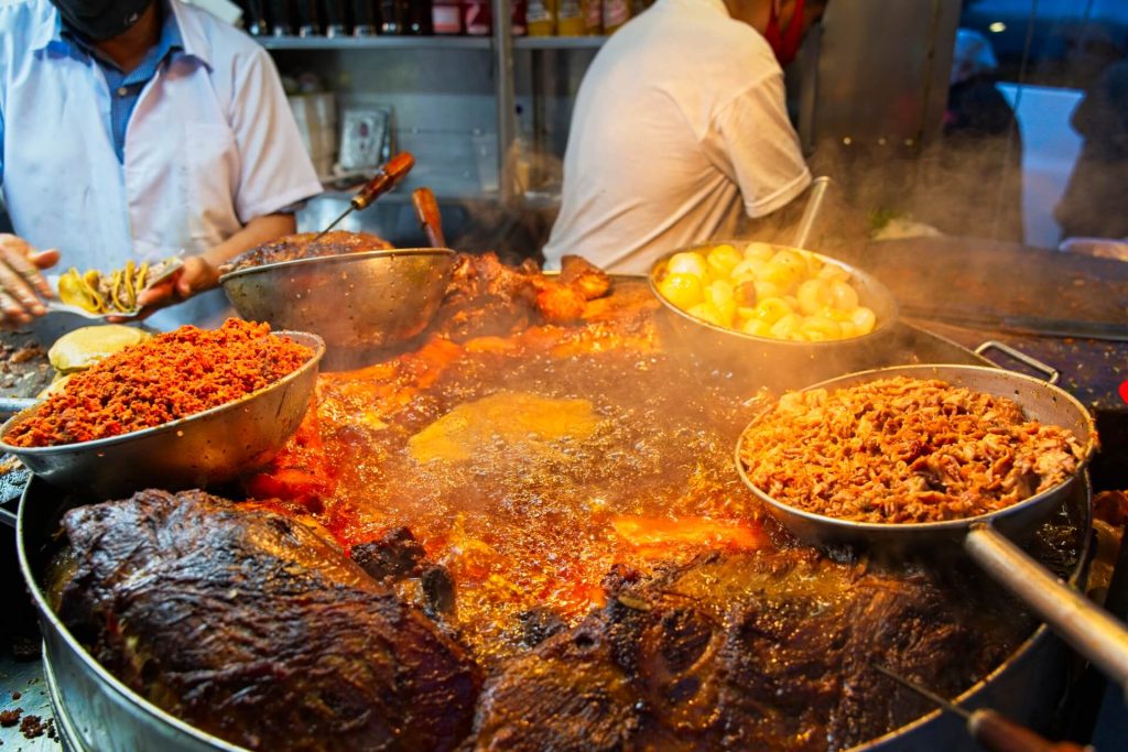 meat cooking in a large pot