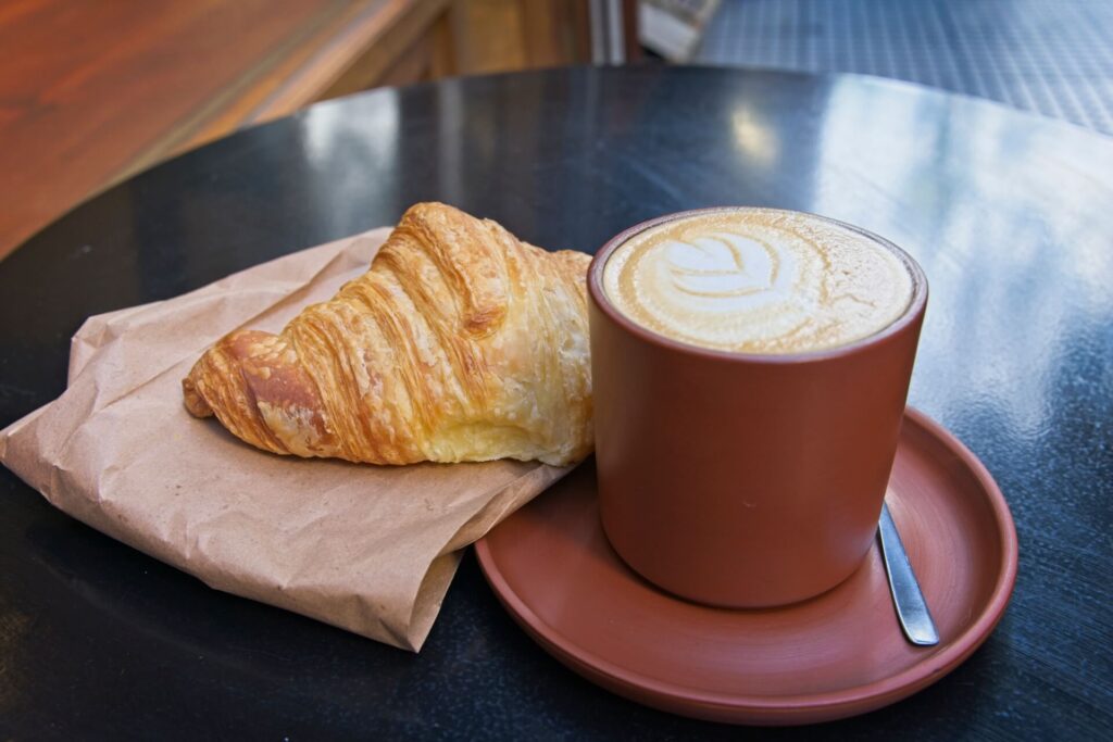 A Latte And Croissant At Bicho Cafe 