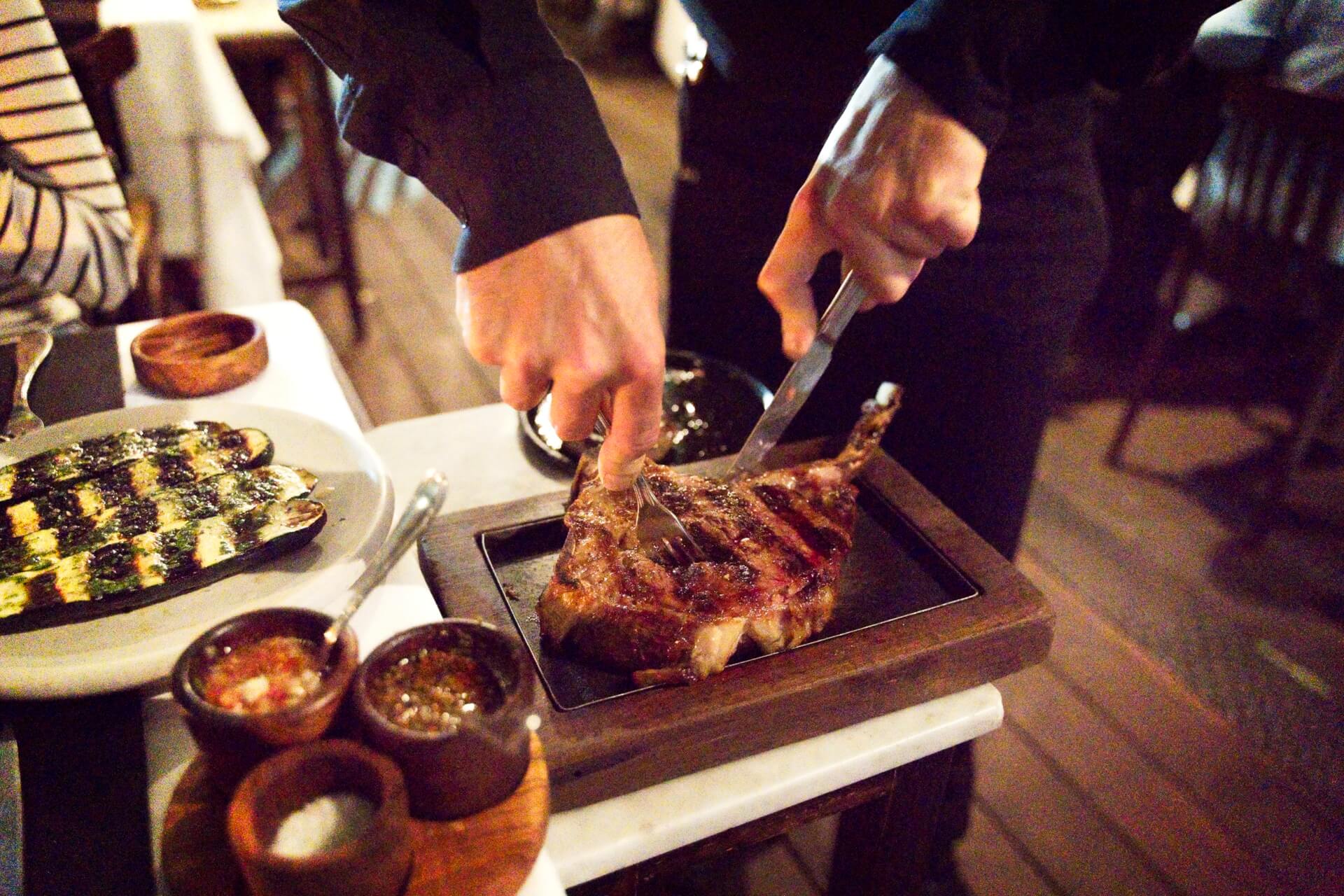 Slicing a steak at don julio buenos aires